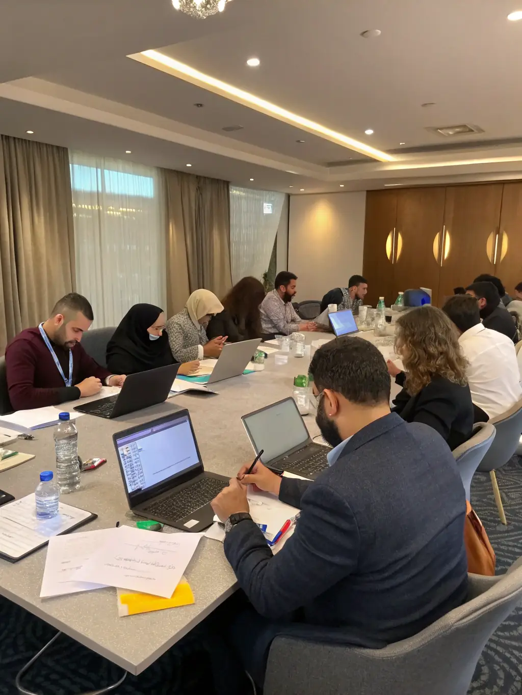 A diverse team of South African professionals participating in a leadership training session, focusing on effective communication and decision-making skills.